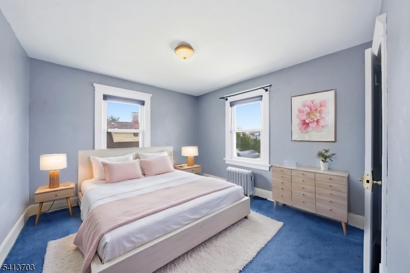 149 Roessler Street Boonton, NJ 07005 - Photo 20 of 42 a bedroom with a large bed and a window