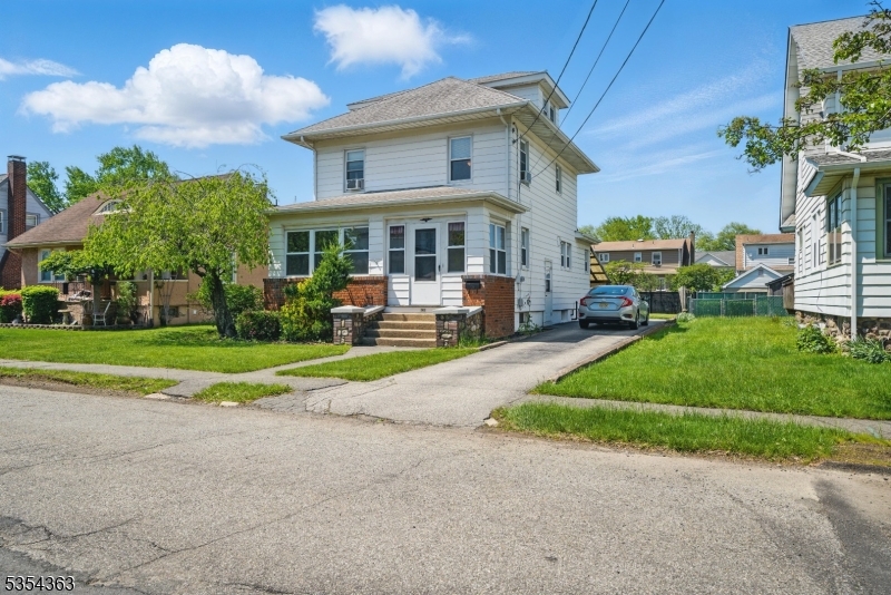 149 Roessler Street Boonton, NJ 07005 - Photo 2 of 30 a view of a house with a yard and plants