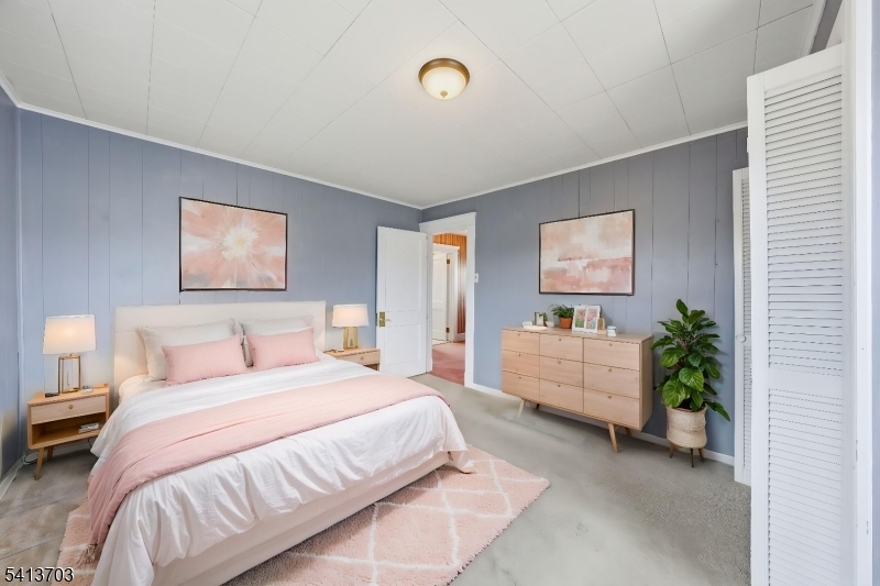 149 Roessler Street Boonton, NJ 07005 - Photo 23 of 42 a bedroom with a bed and a potted plant