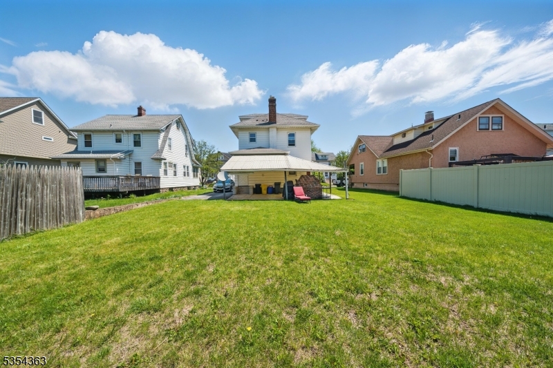 149 Roessler Street Boonton, NJ 07005 - Photo 24 of 30 a front view of a house with a yard and garage