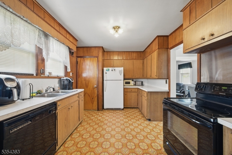 149 Roessler Street Boonton, NJ 07005 - Photo 4 of 42 a kitchen with a sink stove and refrigerator