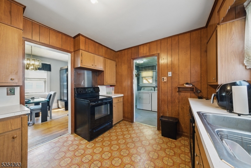 149 Roessler Street Boonton, NJ 07005 - Photo 5 of 42 a kitchen with stainless steel appliances granite countertop a refrigerator stove and sink