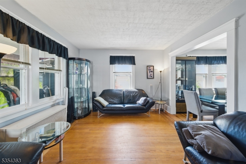 149 Roessler Street Boonton, NJ 07005 - Photo 6 of 30 a living room with furniture and a flat screen tv