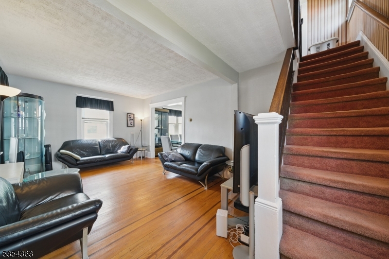 149 Roessler Street Boonton, NJ 07005 - Photo 8 of 30 a living room with furniture and a wooden floor