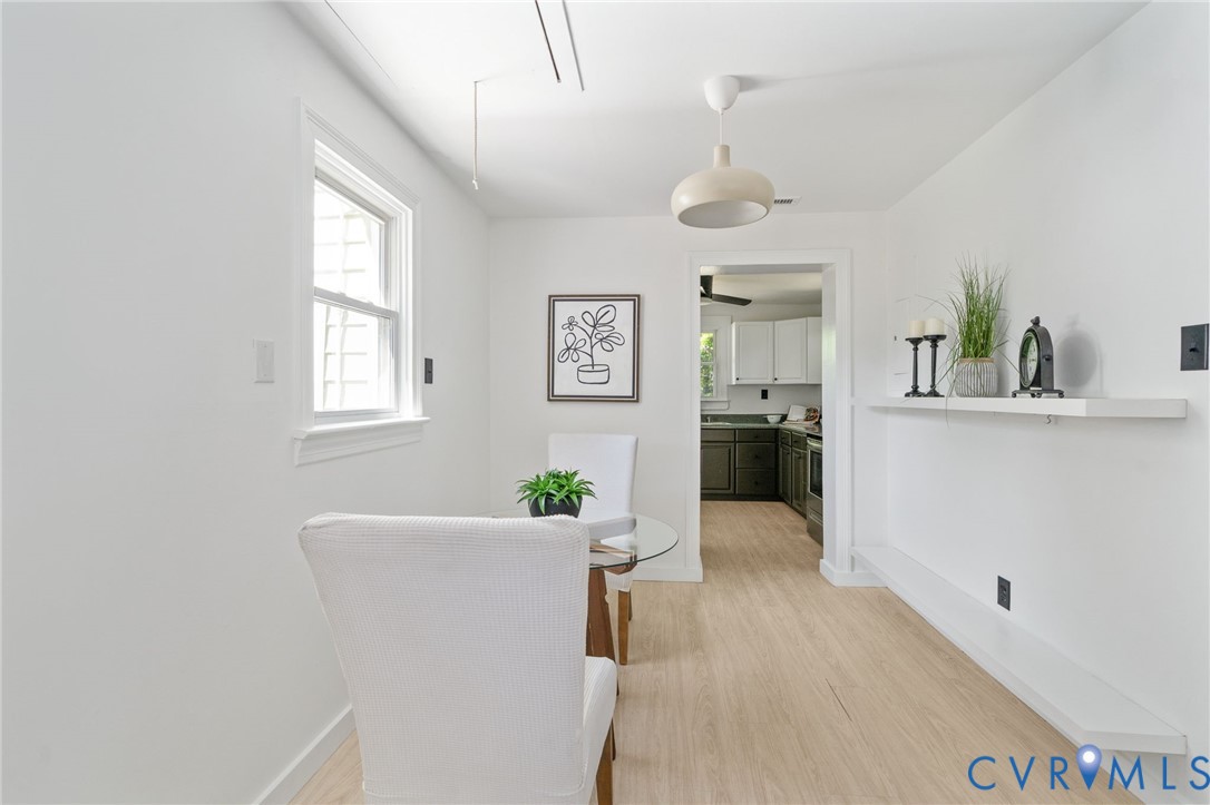 200 Brooks Road Richmond, VA 23223 - Photo 12 of 58 a view of a kitchen and an entryway with wooden floor