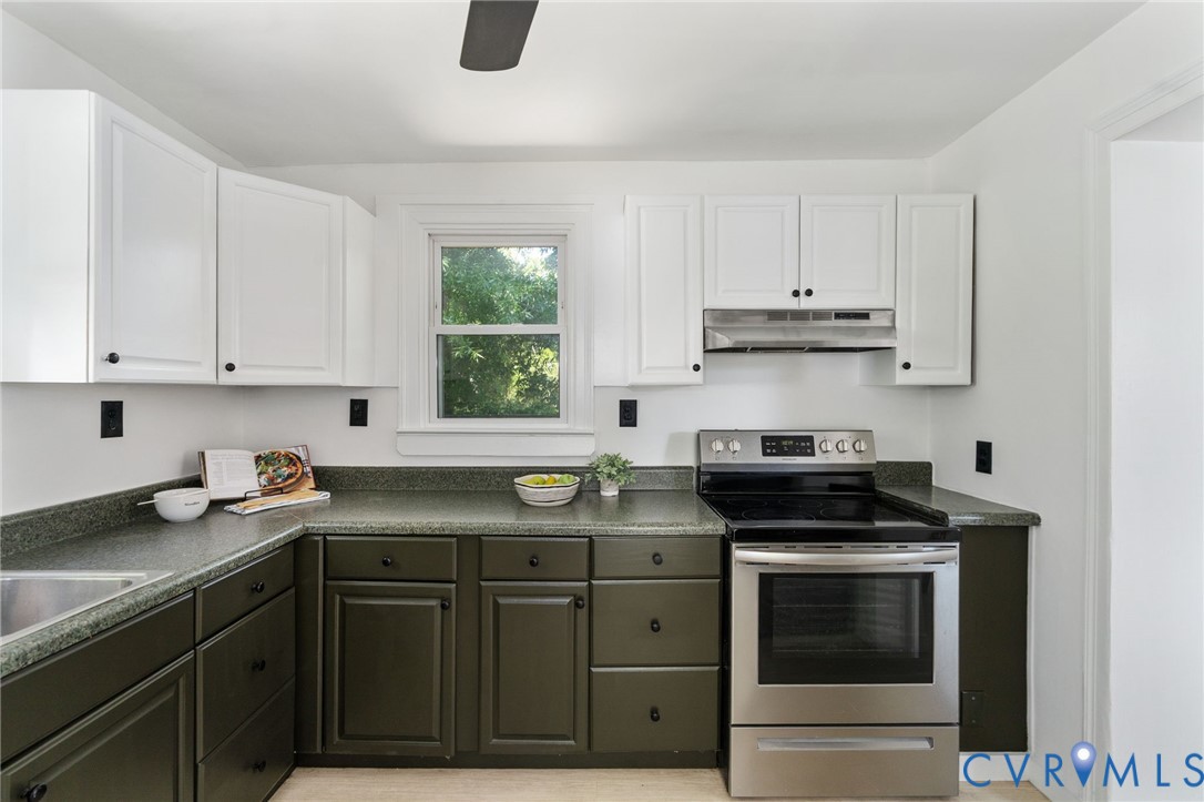 200 Brooks Road Richmond, VA 23223 - Photo 24 of 58 a kitchen with a sink stove and cabinets