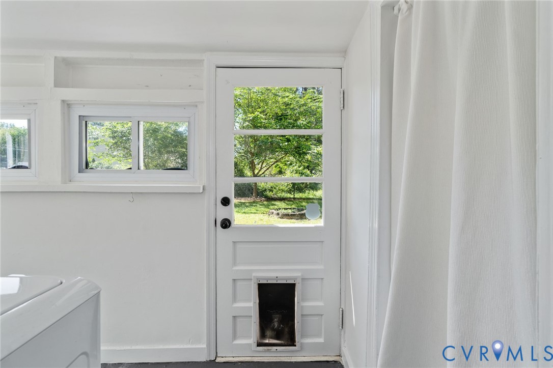 200 Brooks Road Richmond, VA 23223 - Photo 28 of 58 a view of a livingroom with a window and a fireplace