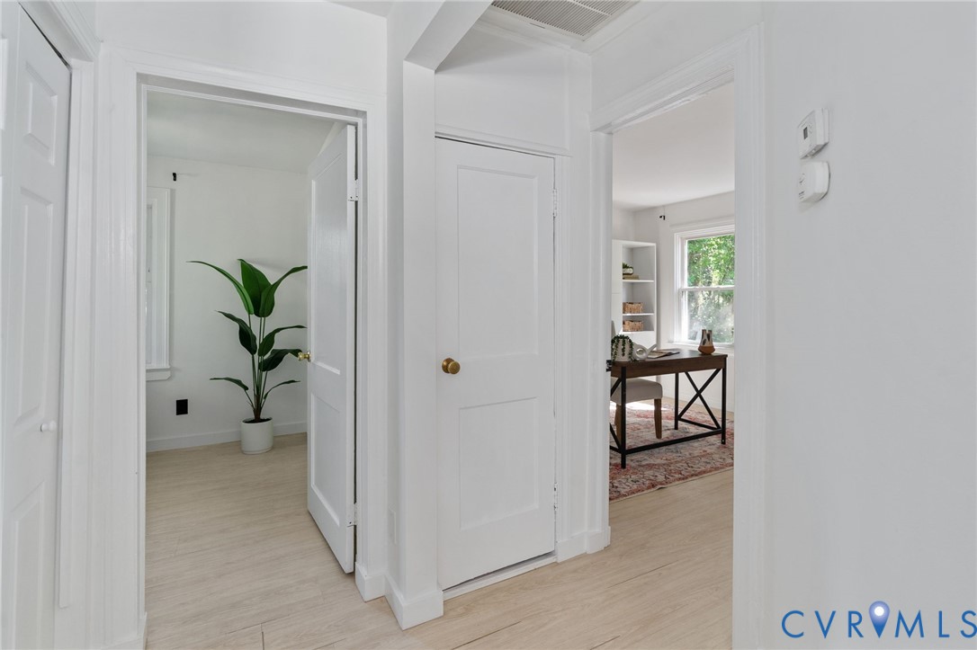 200 Brooks Road Richmond, VA 23223 - Photo 30 of 58 a view of a hallway with wooden floor and a livingroom