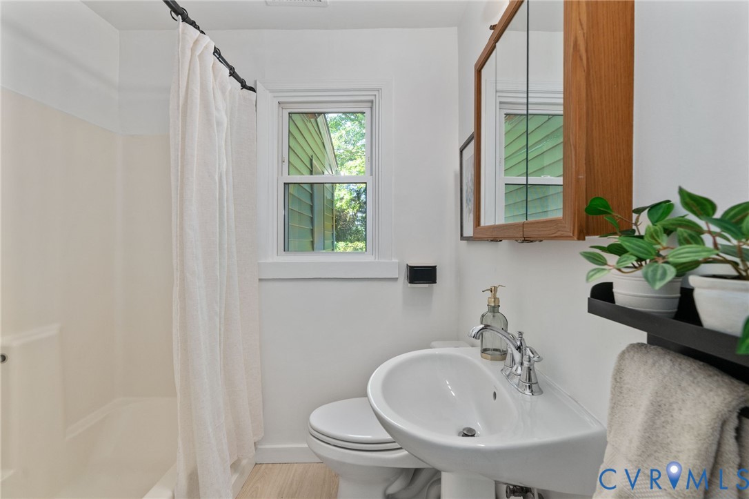 200 Brooks Road Richmond, VA 23223 - Photo 34 of 58 a bathroom with a sink toilet and a mirror