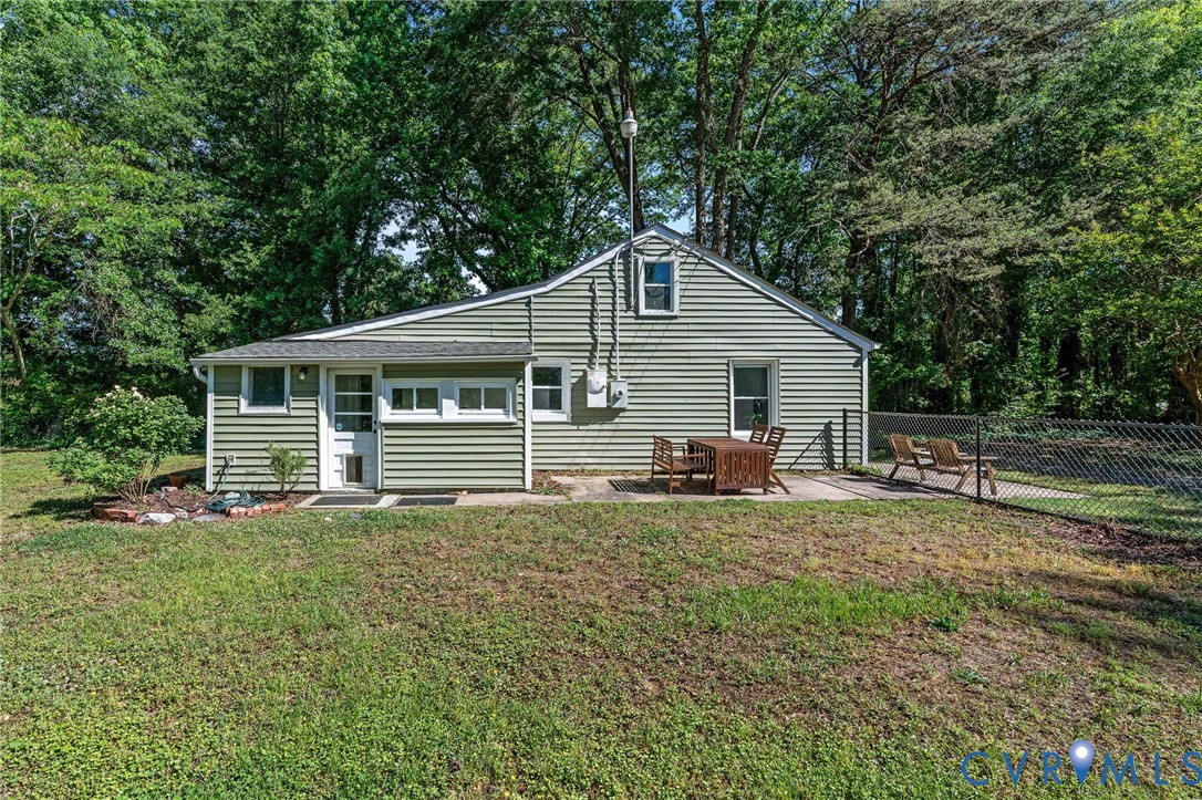 200 Brooks Road Richmond, VA 23223 - Photo 44 of 58 a white house that has a small yard and large trees