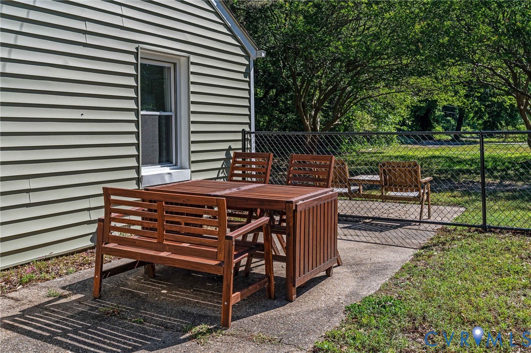 200 Brooks Road Richmond, VA 23223 - Photo 48 of 58 a view of a chairs and tables in the back yard of the house
