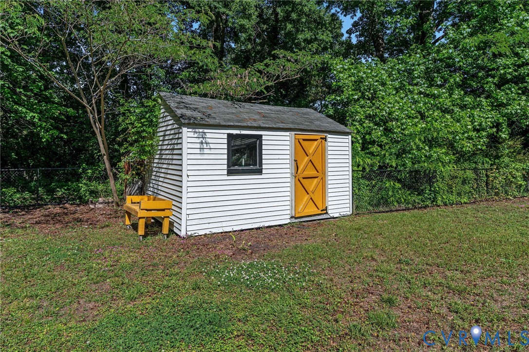 200 Brooks Road Richmond, VA 23223 - Photo 54 of 58 a backyard of a house with table and chairs