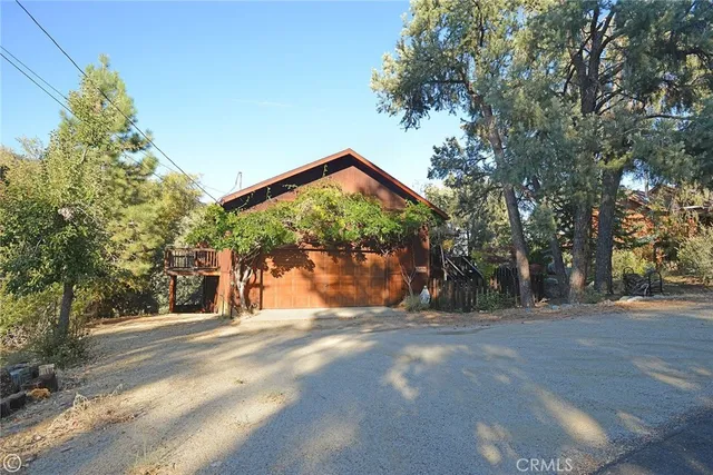 a view of a house with a tree