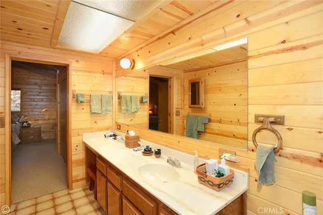 a bathroom with a sink double vanity and a mirror
