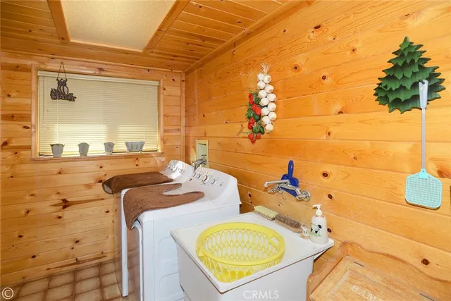 a balcony with wooden floor and outdoor seating