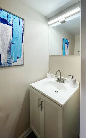 a bathroom with a sink and mirror