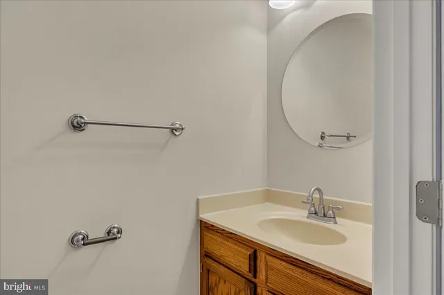 a bathroom with a sink and mirror