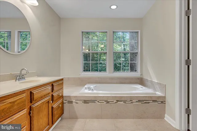 a bath tub sitting next to a window