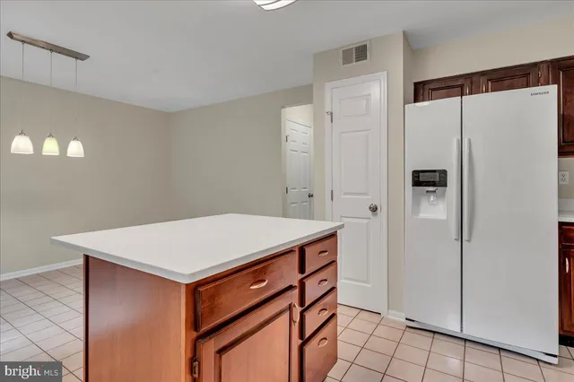 a utility room with cabinets washer and dryer