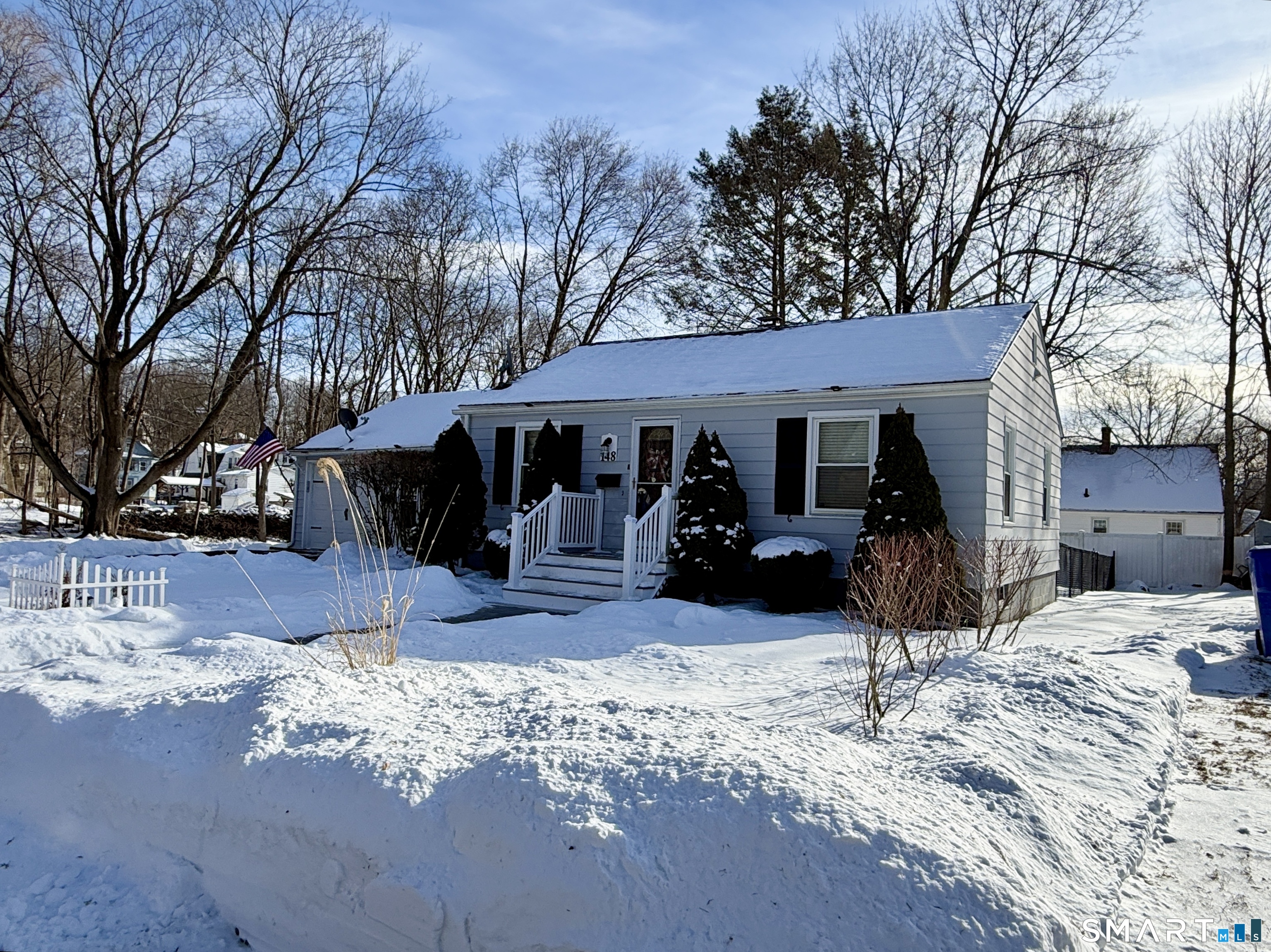 148 Lois Street Torrington, CT 06790 - Photo 3 of 17 a view of a house with a yard covered in snow