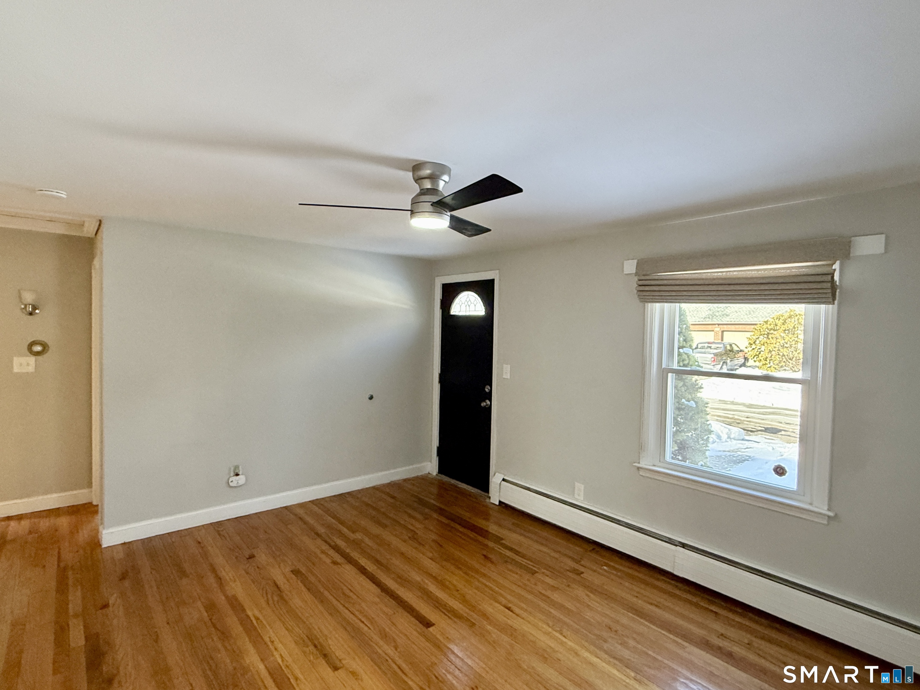 148 Lois Street Torrington, CT 06790 - Photo 9 of 17 wooden floor in an empty room with a window