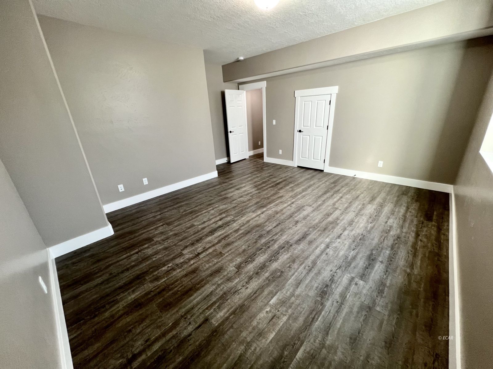 298 Ridgeway Drive Spring Creek, NV 89815 - Photo 36 of 45 a view of an empty room and wooden floor