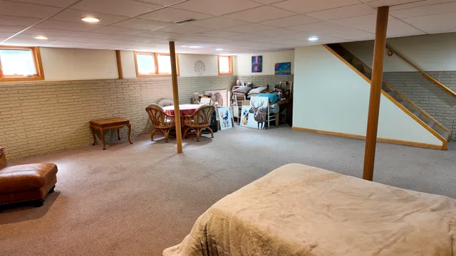 a bed room with a bed and a chair