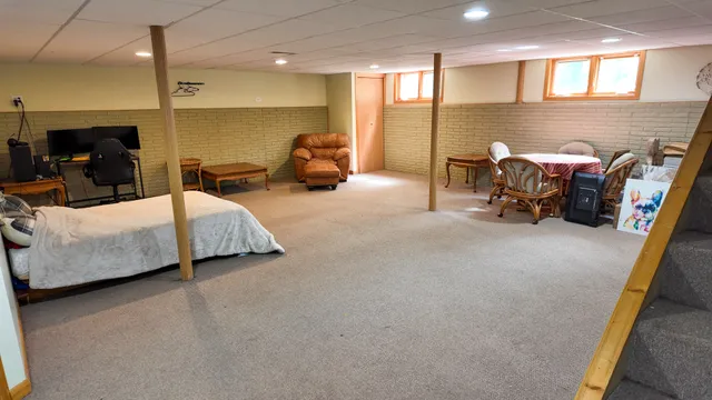 a bed room with furniture and a lamp