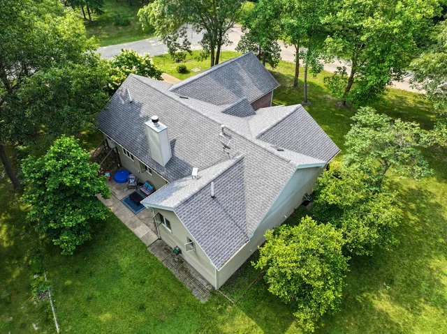 an aerial view of house with yard