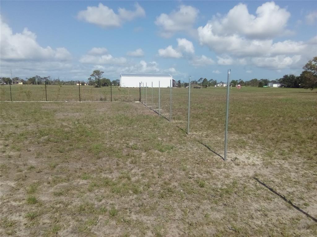102 Harness Road Placida, FL 33946 - Photo 9 of 12 a view of a lake with a big yard