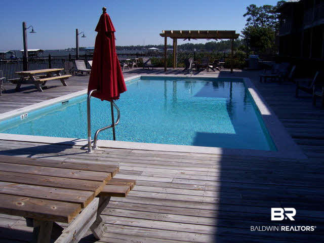 25773 Canal Road, Unit 16 Orange Beach, AL 36561 - Photo 9 of 12 1 of 2 pools on the complex--this one overlooks wolf Bay. Gunite. also outdoor cooking area and community lodge with restrooms