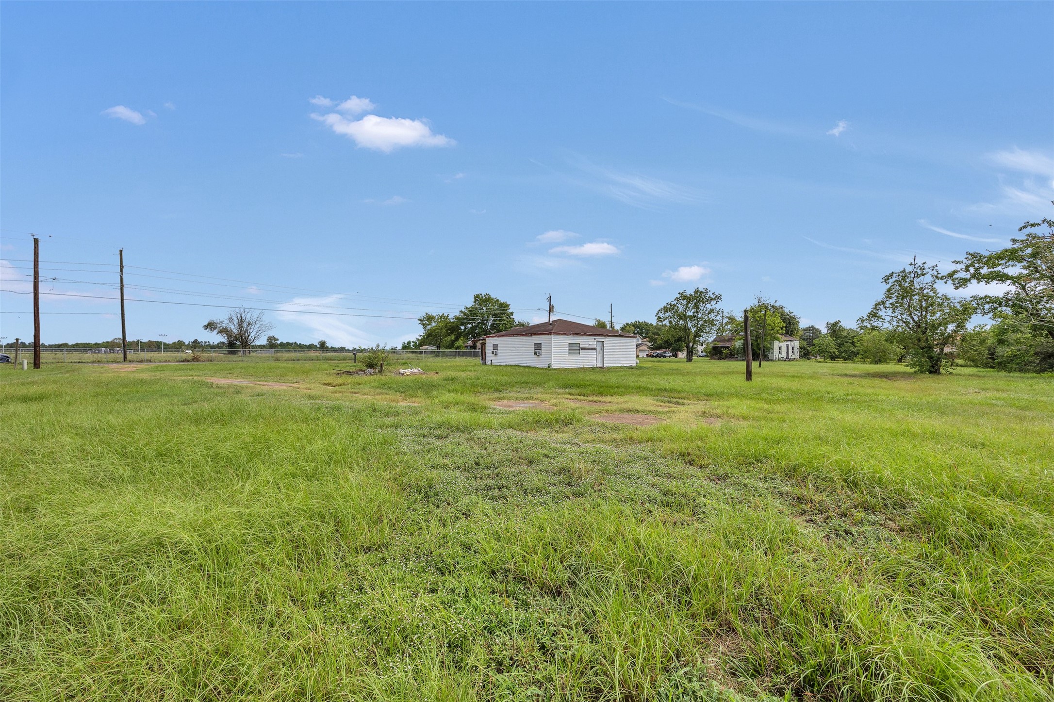 3727 Stella Road Brookshire, TX 77423 - Photo 6 of 19 a backyard of a house with lots of green space and fog