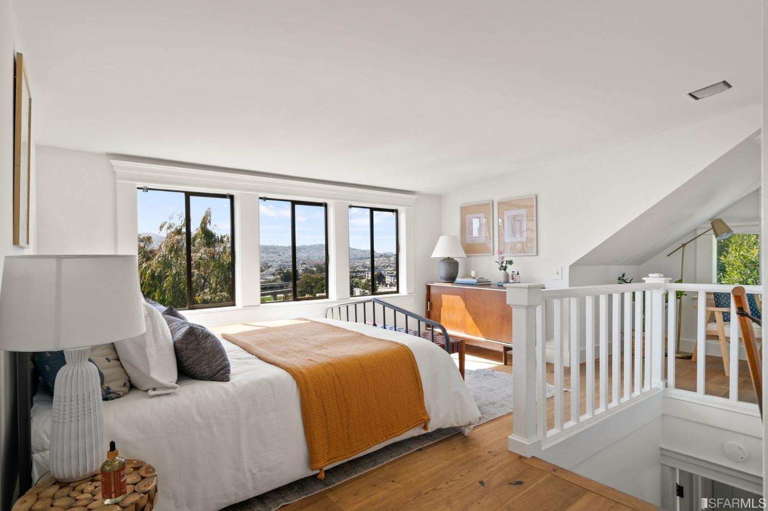 3045 Castro Street San Francisco, CA 94131 - Photo 13 of 44 a bedroom with a bed and a large window