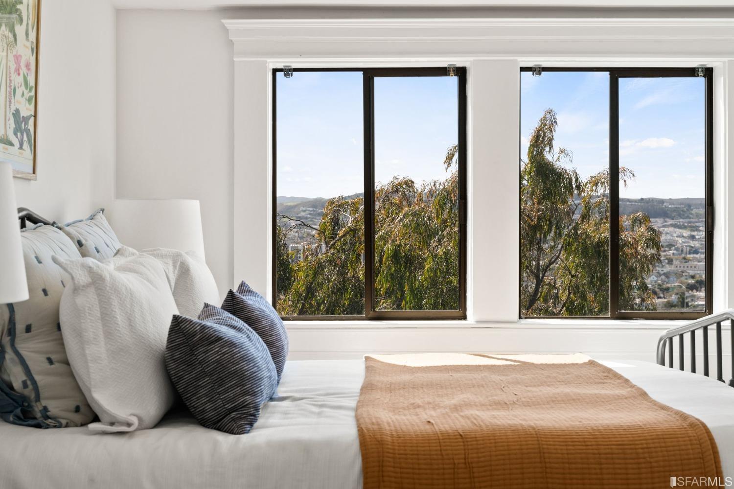 3045 Castro Street San Francisco, CA 94131 - Photo 15 of 44 a bed sitting in a bedroom next to a window