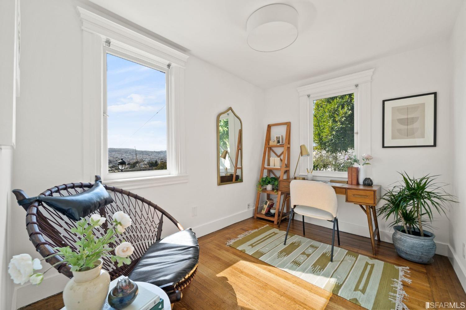 3045 Castro Street San Francisco, CA 94131 - Photo 20 of 44 a living room with furniture flowerpot and a potted plant