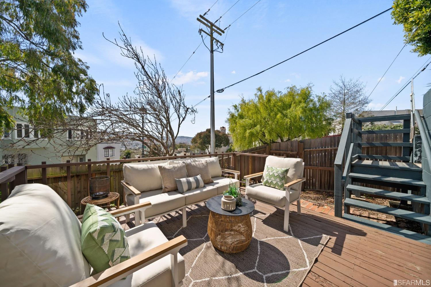3045 Castro Street San Francisco, CA 94131 - Photo 25 of 44 a view of a balcony with chairs and a potted plant