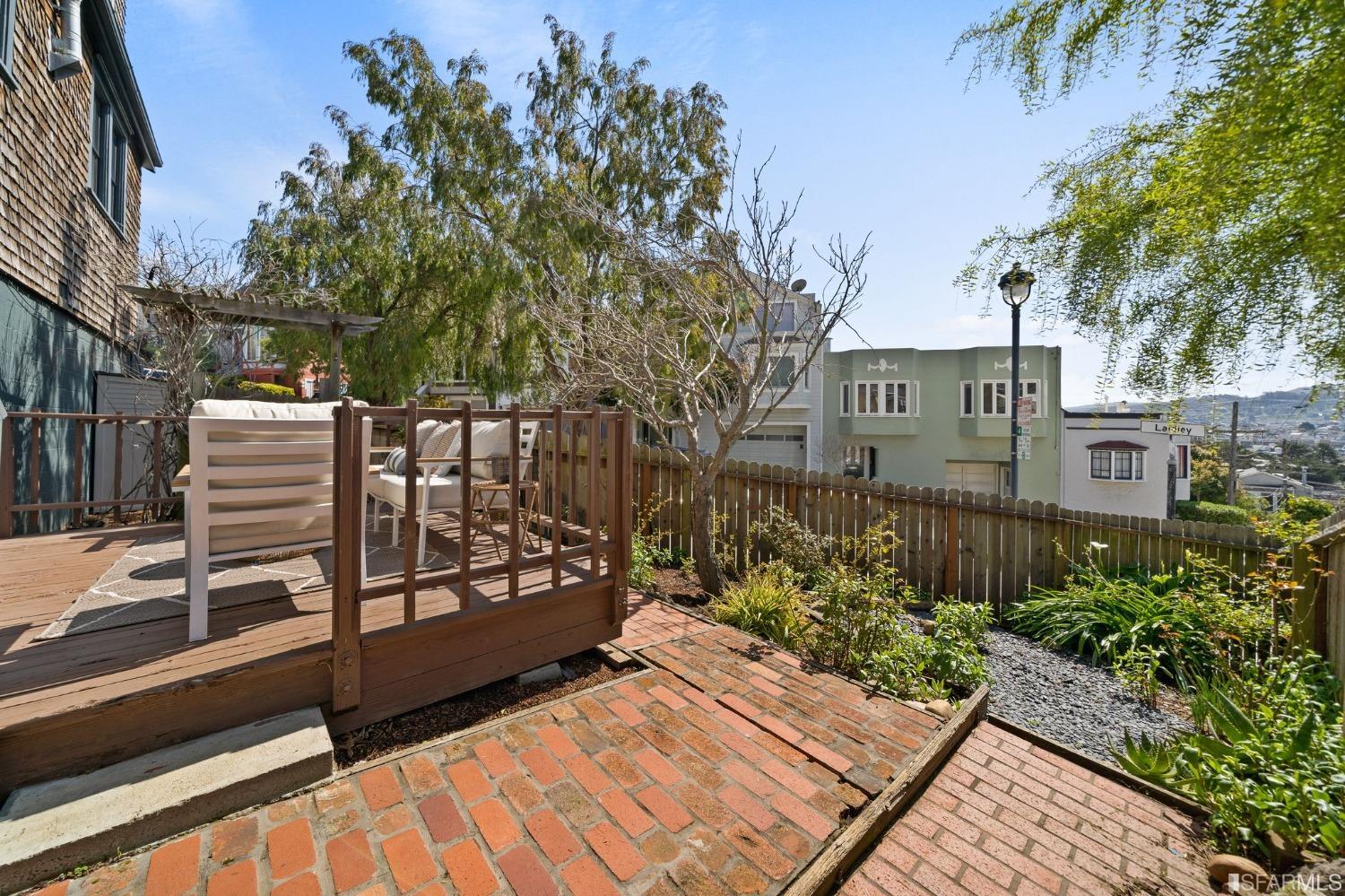 3045 Castro Street San Francisco, CA 94131 - Photo 26 of 44 a view of a chairs and table in the backyard