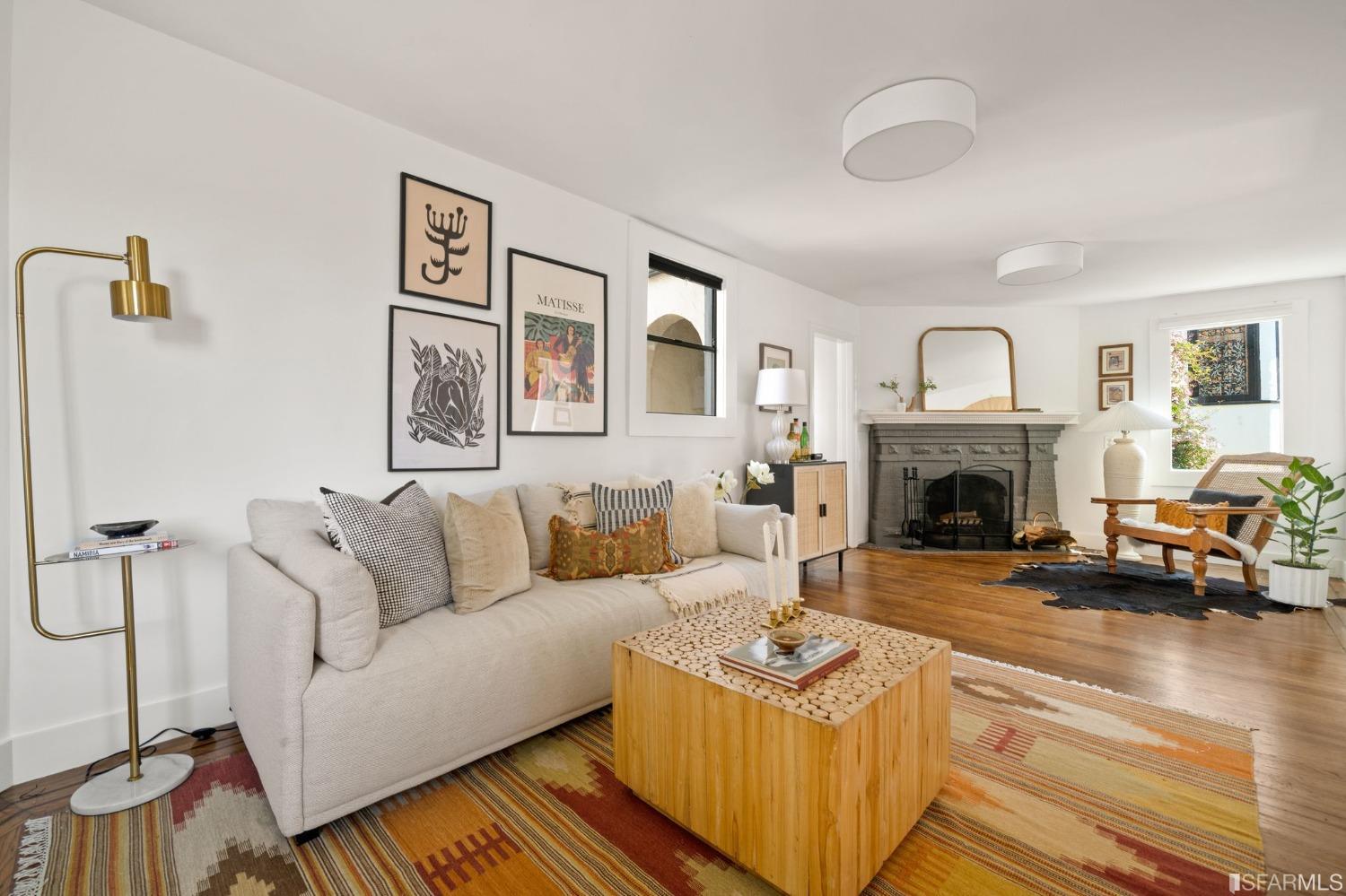 3045 Castro Street San Francisco, CA 94131 - Photo 5 of 44 a living room with furniture and a fireplace