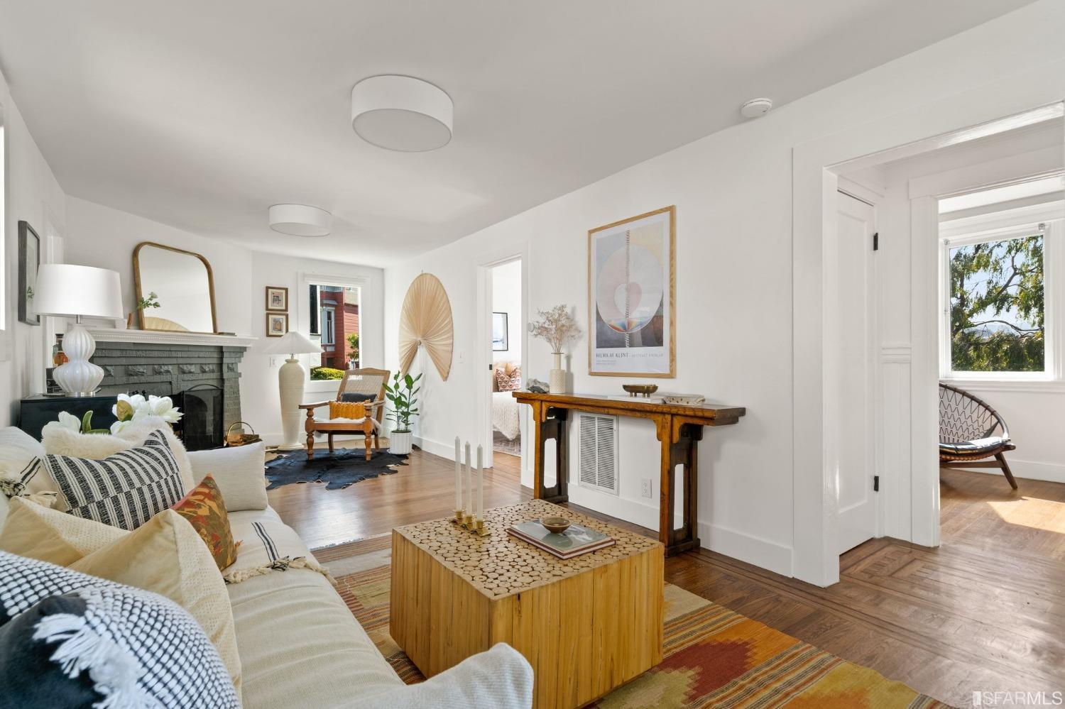 3045 Castro Street San Francisco, CA 94131 - Photo 6 of 44 a living room with furniture a fireplace and a table