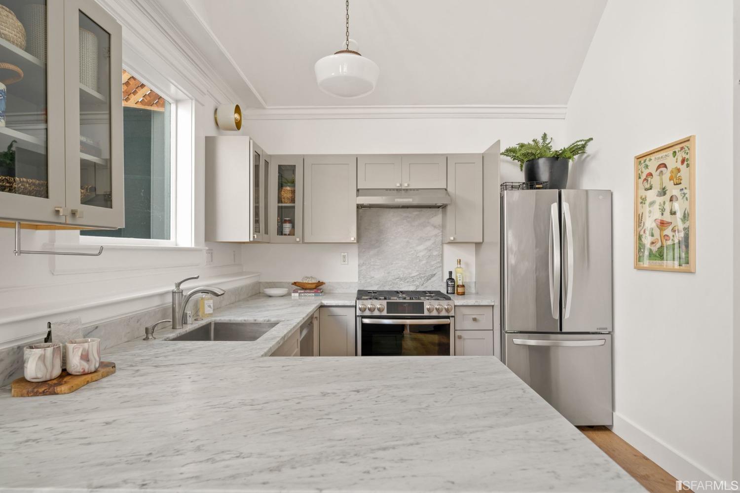 3045 Castro Street San Francisco, CA 94131 - Photo 9 of 44 a kitchen with stainless steel appliances granite countertop a refrigerator sink and stove