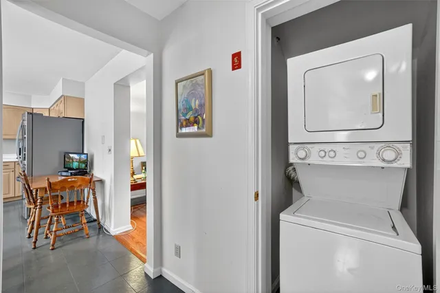 a view of a hallway with seating area