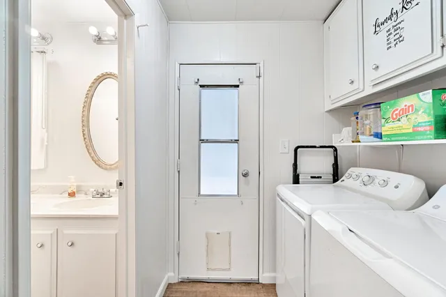 a view of bathroom with dual sinks