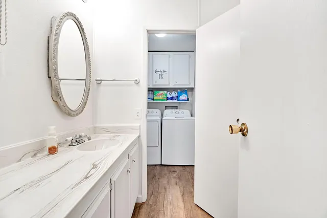 a bathroom with a sink and a mirror