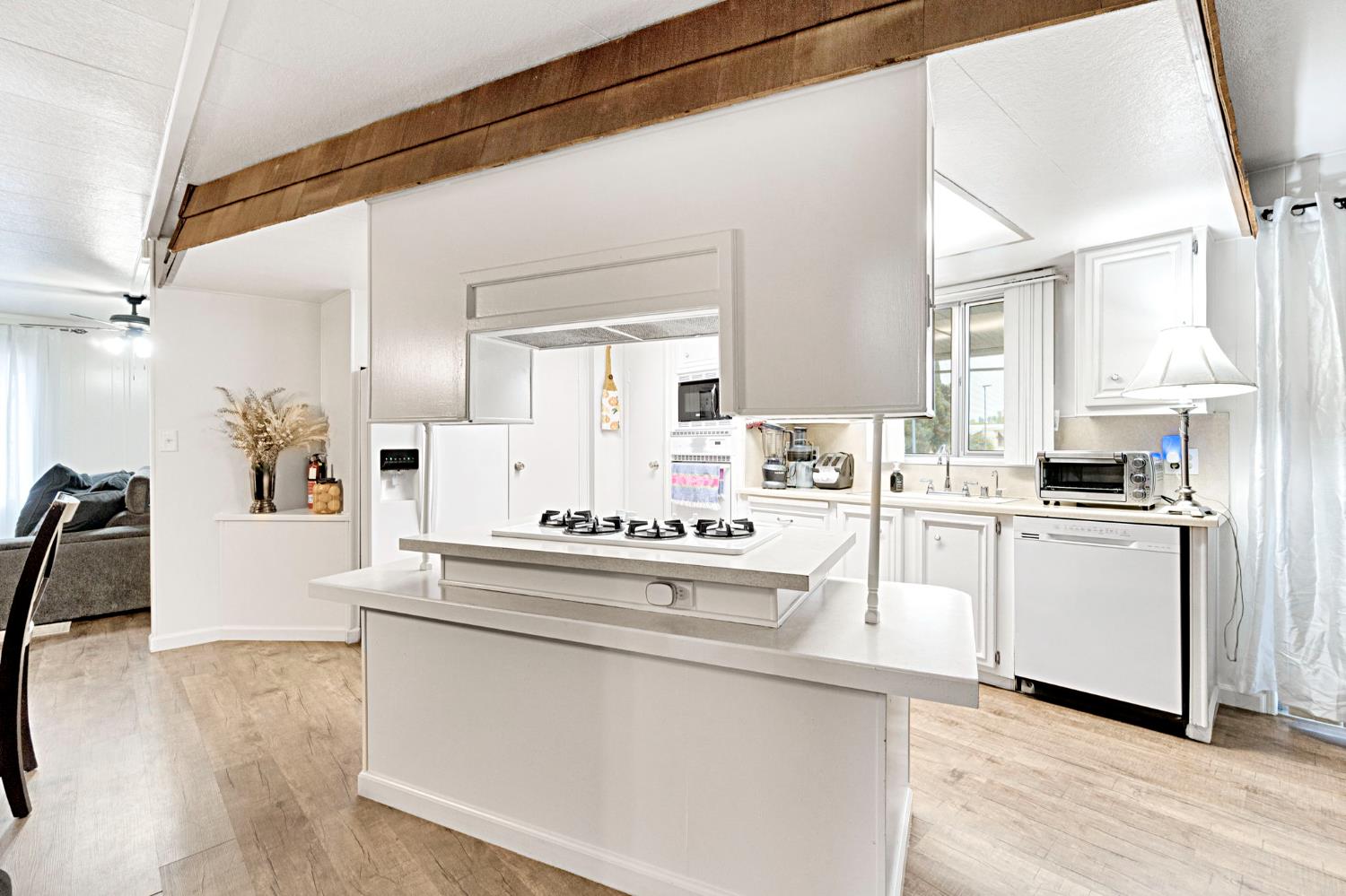 3556 North Duke Avenue, Unit 165 Fresno, CA 93727 - Photo 9 of 25 a kitchen with white cabinets and white appliances