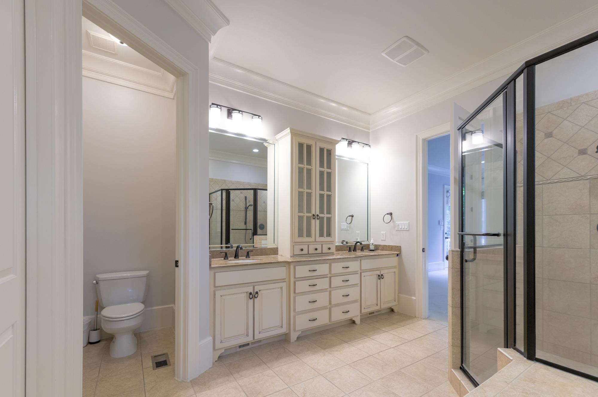 1417 Caistor Lane Raleigh, NC 27614 - Photo 18 of 42 Primary ensuite 5-piece bath with jetted tub, dual vanities, huge walk-in shower w dual heads, and separate water closet