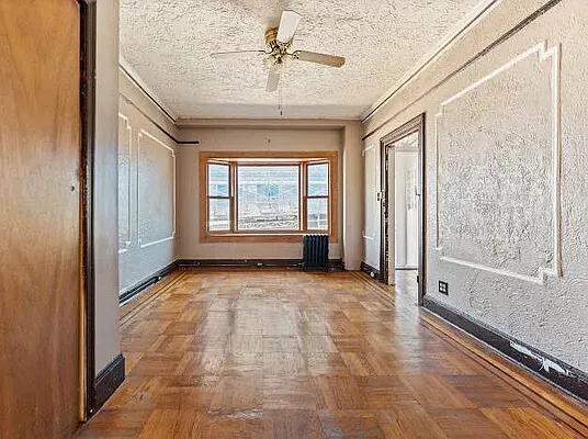 a view of an empty room with a window