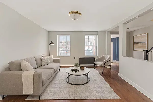 a living room with furniture and a large window