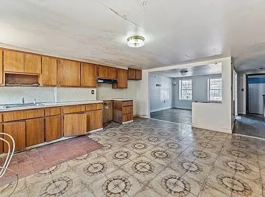 a kitchen with stainless steel appliances granite countertop a sink cabinets and granite counter tops