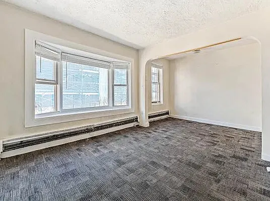 an empty room with windows