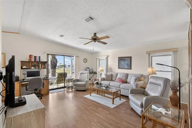 a living room with furniture or couch and a flat screen tv